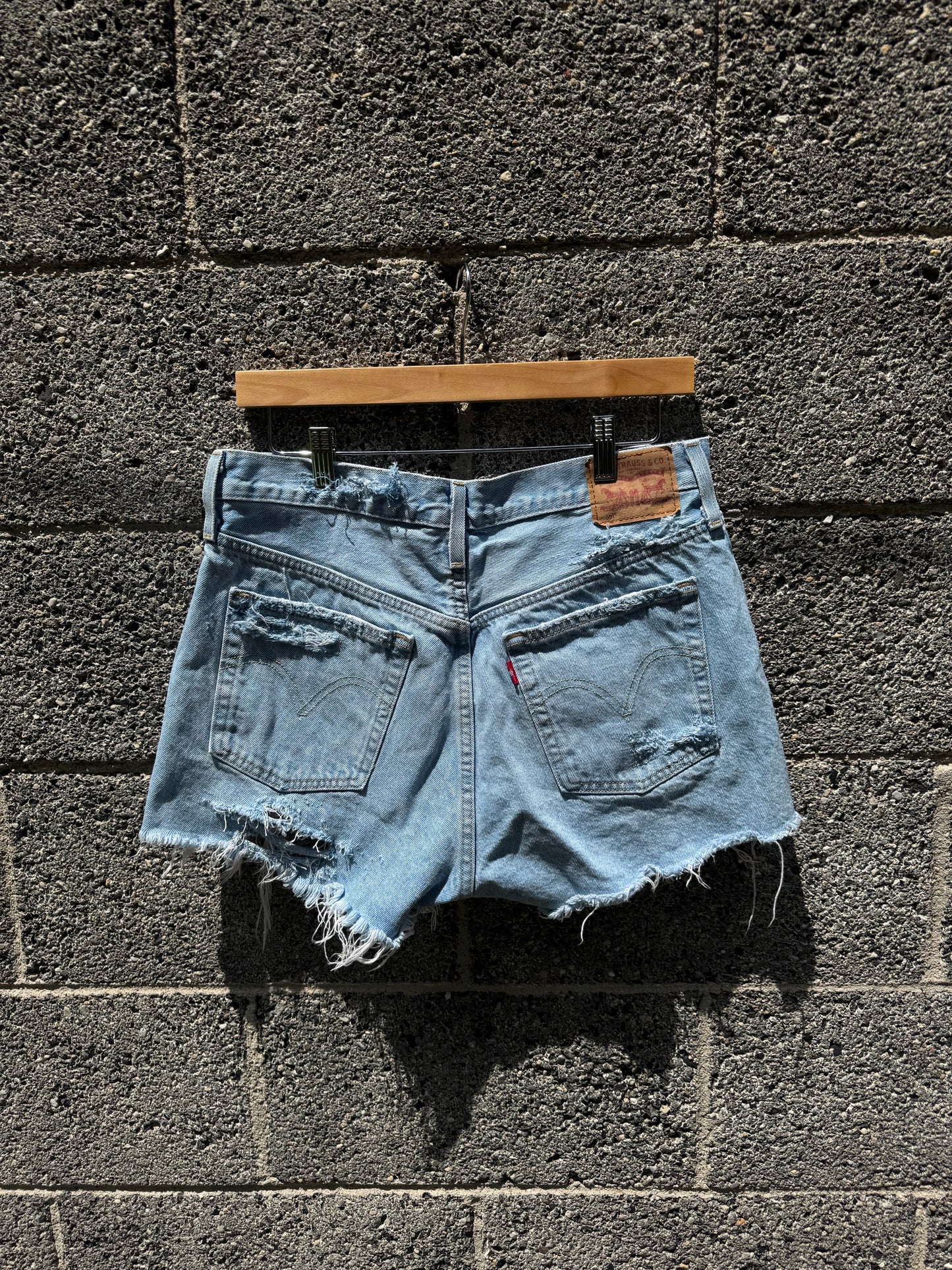 Distressed women’s Levi shorts: SIZE 31 ( 7/8 )