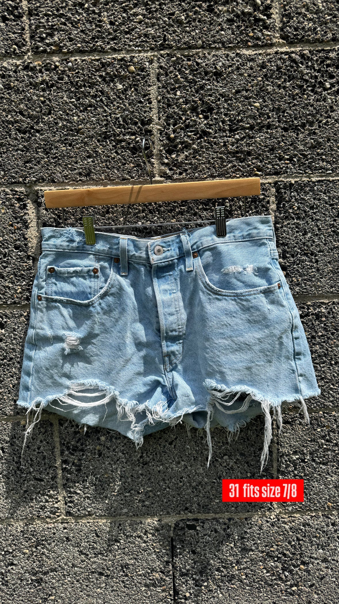 Distressed women’s Levi shorts: SIZE 31 ( 7/8 )