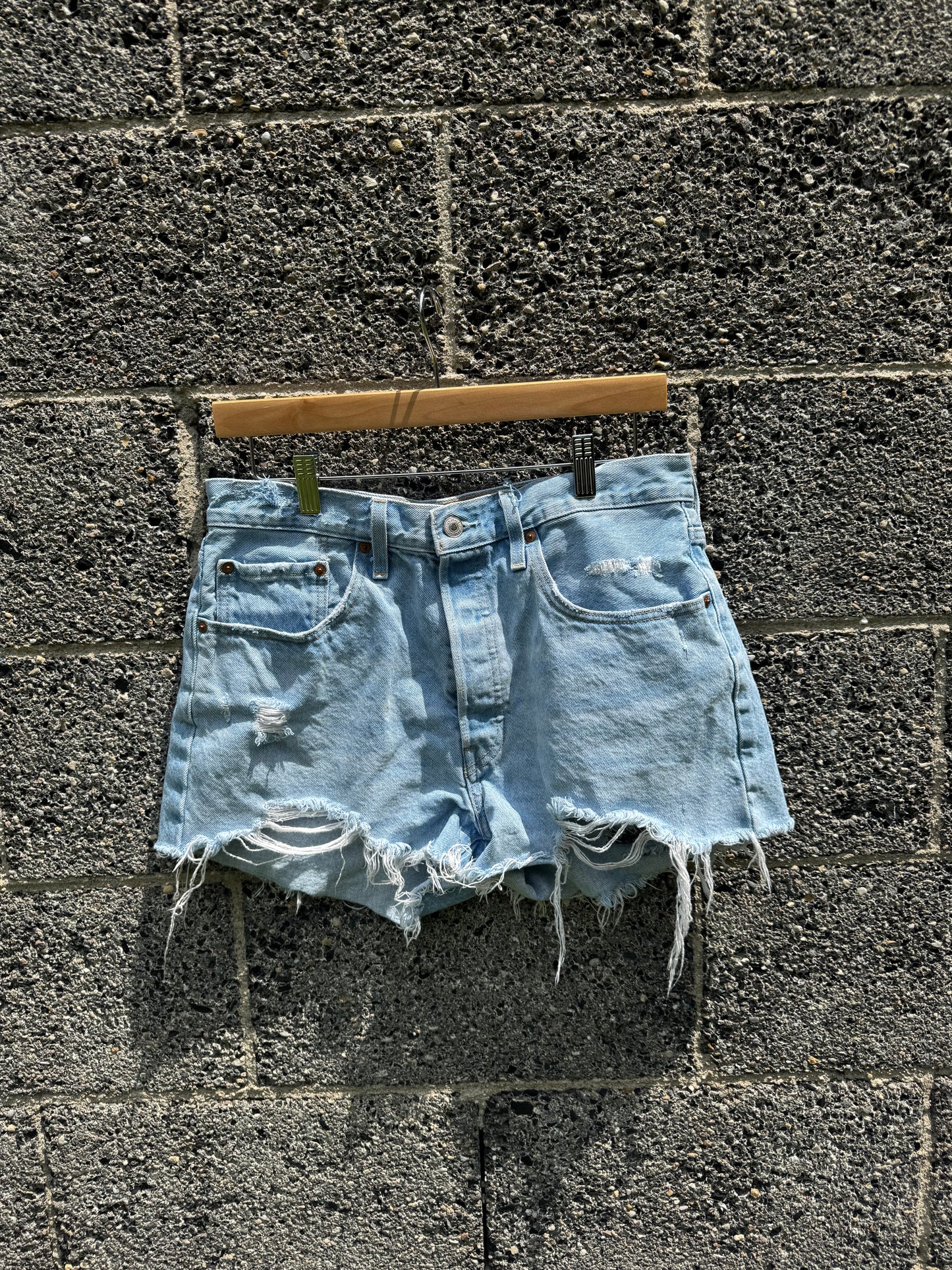 Distressed women’s Levi shorts: SIZE 31 ( 7/8 )